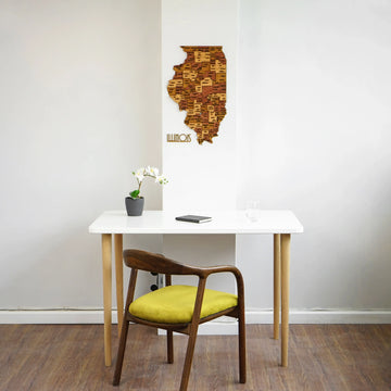 Wooden Illinois wall map above a white desk, wide view with a yellow-cushioned chair