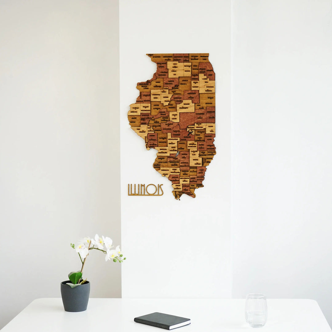 Wooden Illinois map with its ILLINOIS lettering above a white desk, close view