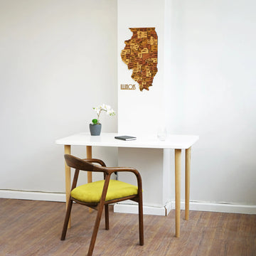 Illinois wooden wall map, wide room view above a white desk