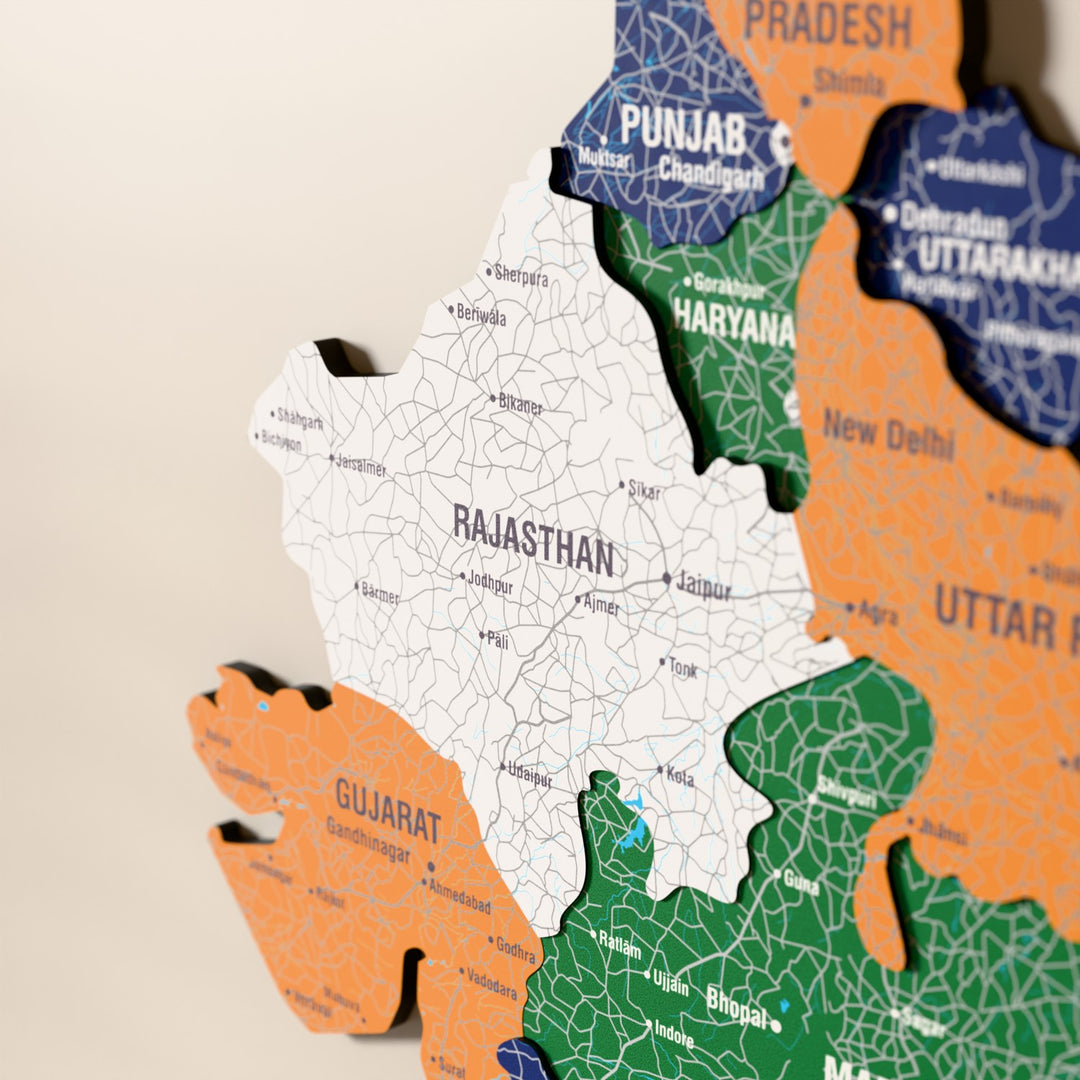 Close-up of the Flag colored India wooden wall map with layered regions and printed names