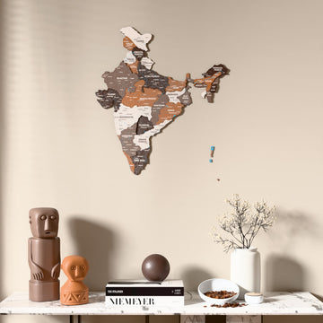 Soil India wooden wall map above a marble console, front view