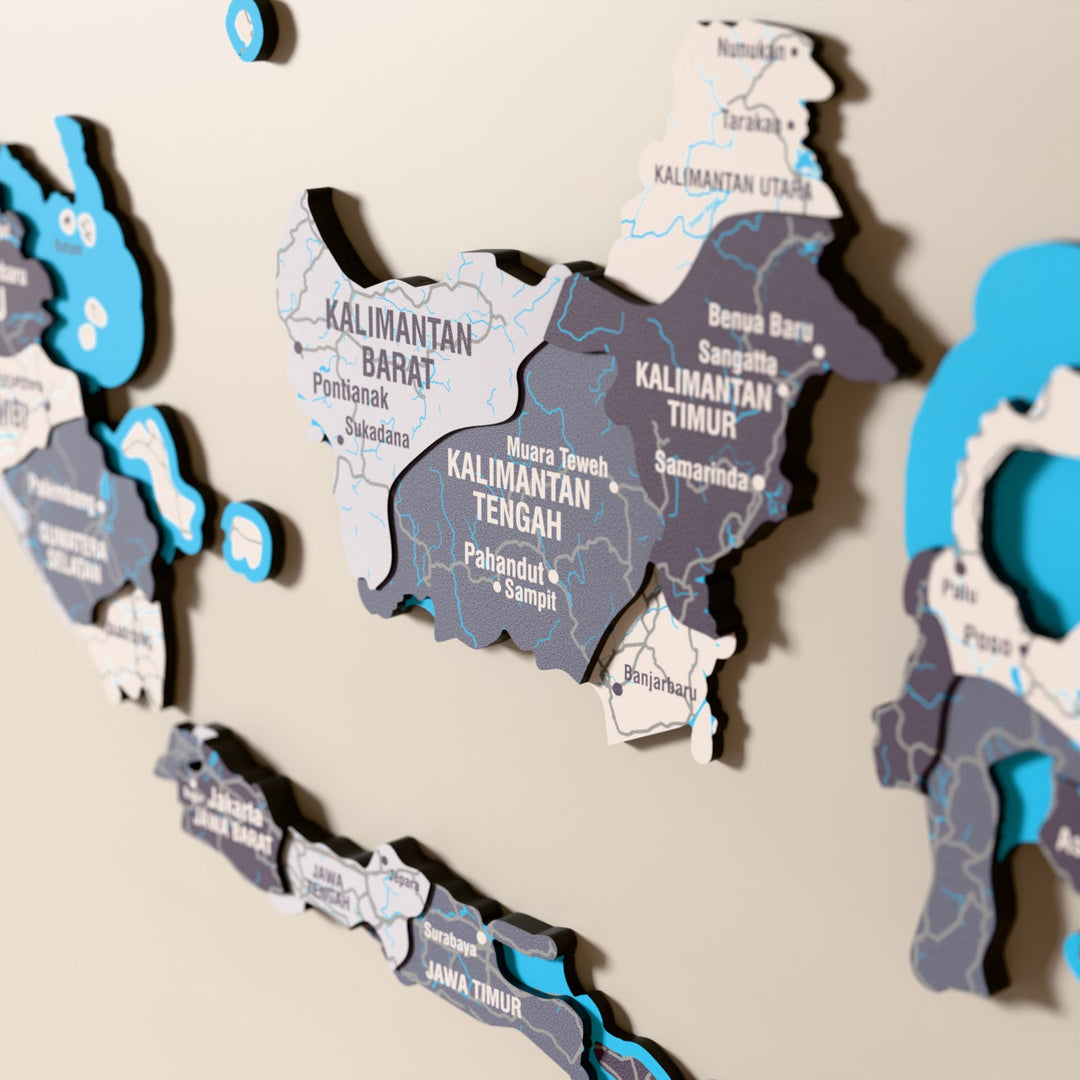 Close-up of the Nimbus Indonesia wooden wall map with layered regions and printed names