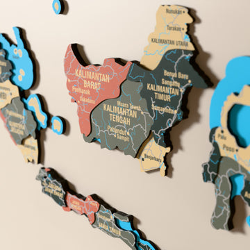 Close-up of the Sage Indonesia wooden wall map with layered regions and printed names