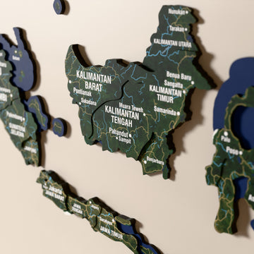 Close-up of the Satellite Indonesia wooden wall map with layered regions and printed names
