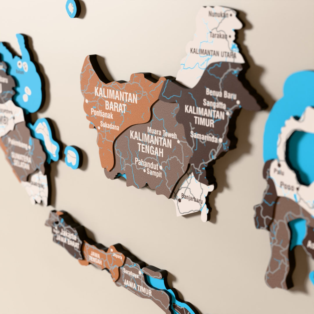 Close-up of the Soil Indonesia wooden wall map with layered regions and printed names