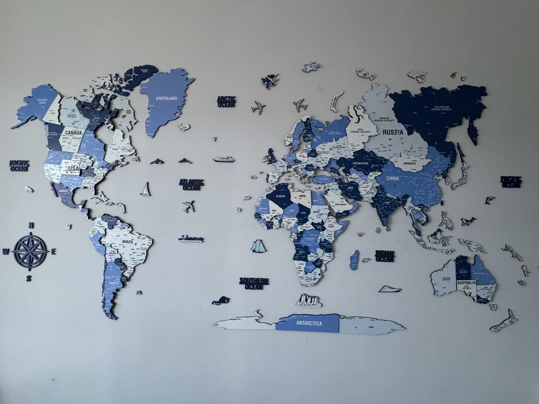 Wooden World Map with Pins - 3D & Vibrant Colors (Navy) in a customer's home