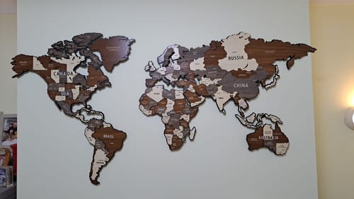 Wooden World Map Puzzle - 3d Wood Push Pin Maps, Wooden on Metal in a customer's home