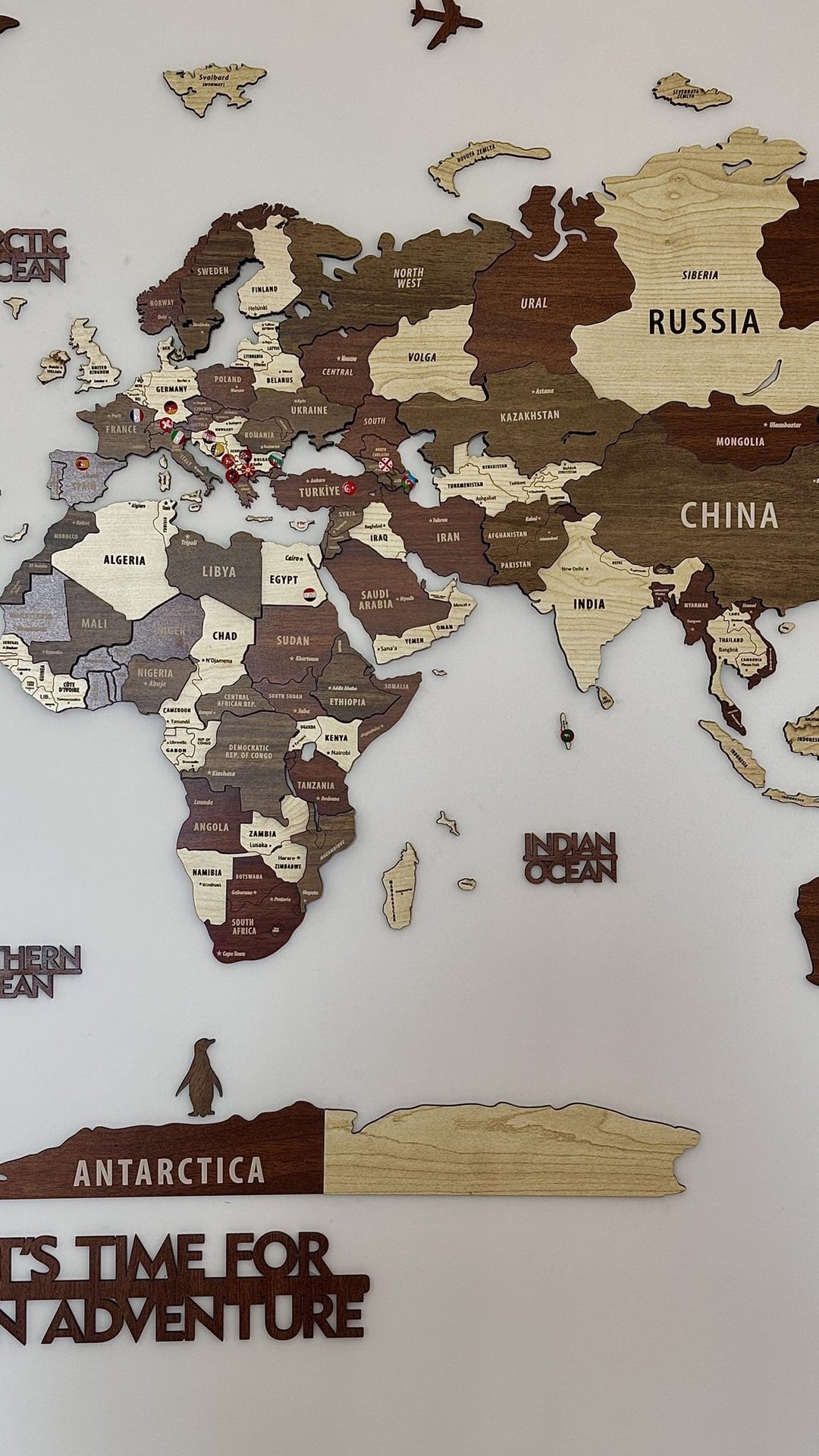 Wooden World Map Wall Art - 3d Wood Push Pin Maps, Multicolor in a customer's home