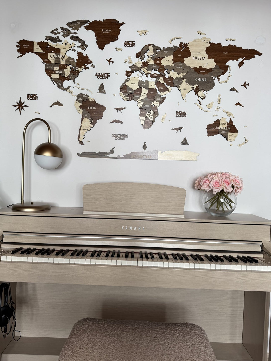 Wooden World Map Wall Art - 3d Wood Push Pin Maps, Multicolor in a customer's home