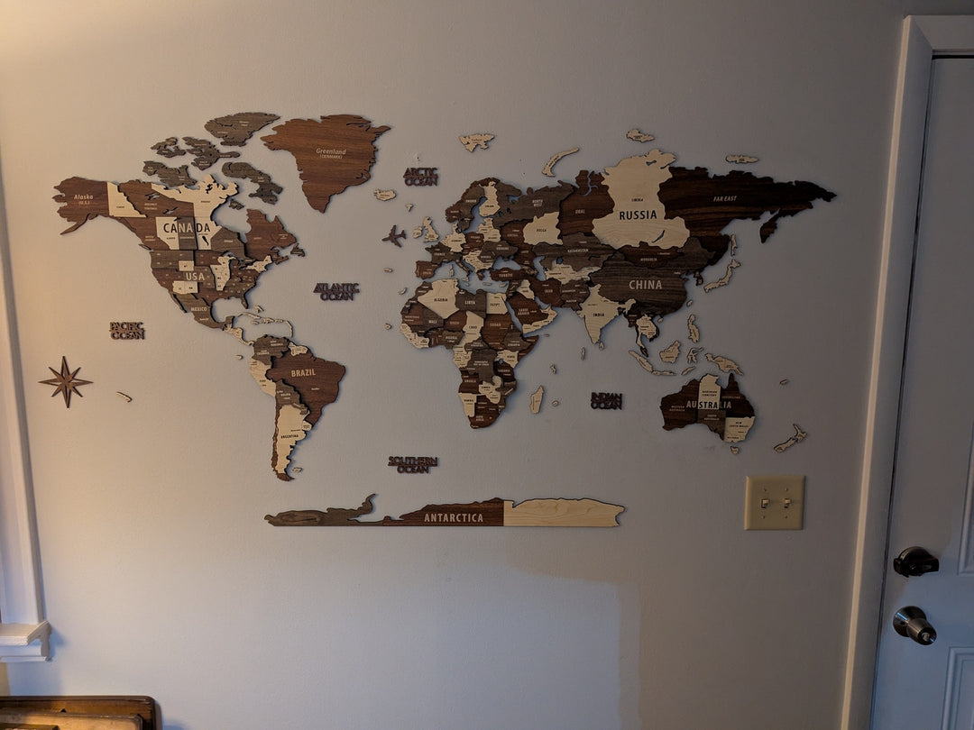 Wooden World Map Wall Art - 3d Wood Push Pin Maps, Multicolor in a customer's home