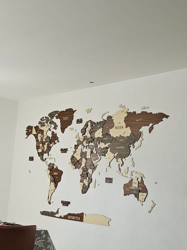 Wooden World Map Wall Art - 3d Wood Push Pin Maps, Multicolor in a customer's home