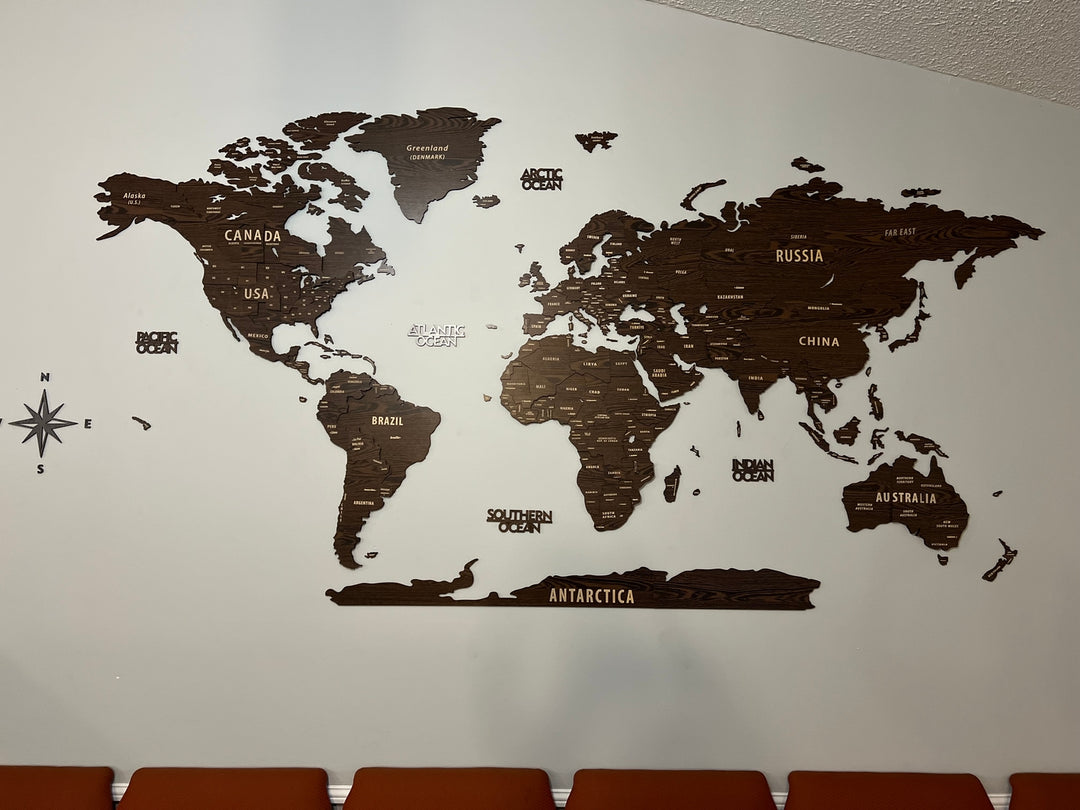 Wooden World Map Wall Art - 3d Wood Push Pin Maps, Multicolor in a customer's home