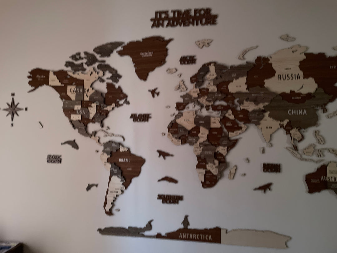Wooden World Map Wall Art - 3d Wood Push Pin Maps, Multicolor in a customer's home