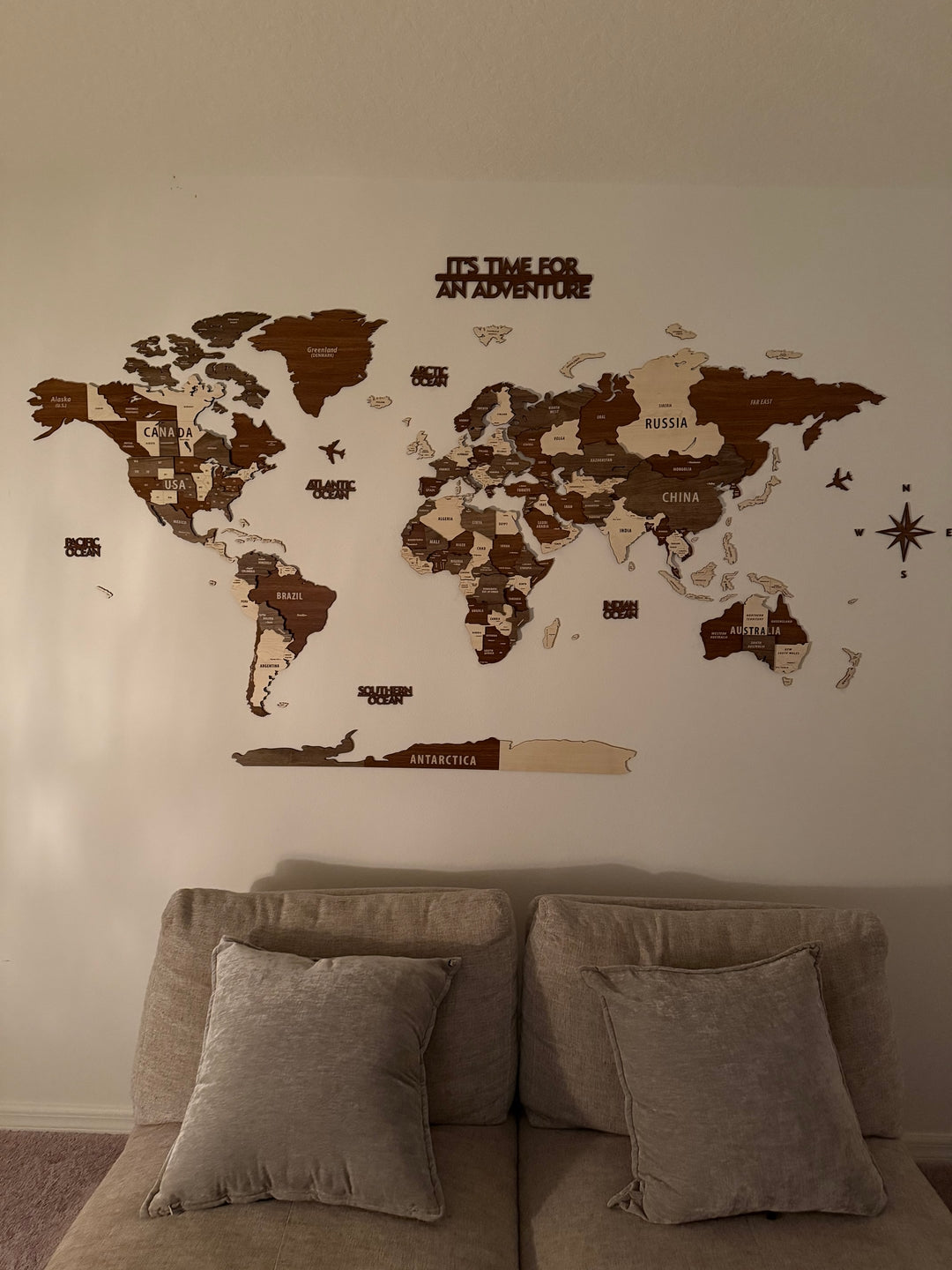 Wooden World Map Wall Art - 3d Wood Push Pin Maps, Multicolor in a customer's home