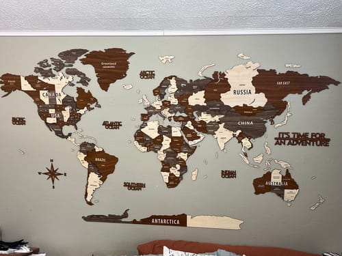 Wooden World Map Wall Art - 3d Wood Push Pin Maps, Multicolor in a customer's home