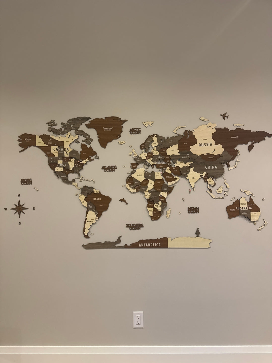 Wooden World Map Wall Art - 3d Wood Push Pin Maps, Multicolor in a customer's home