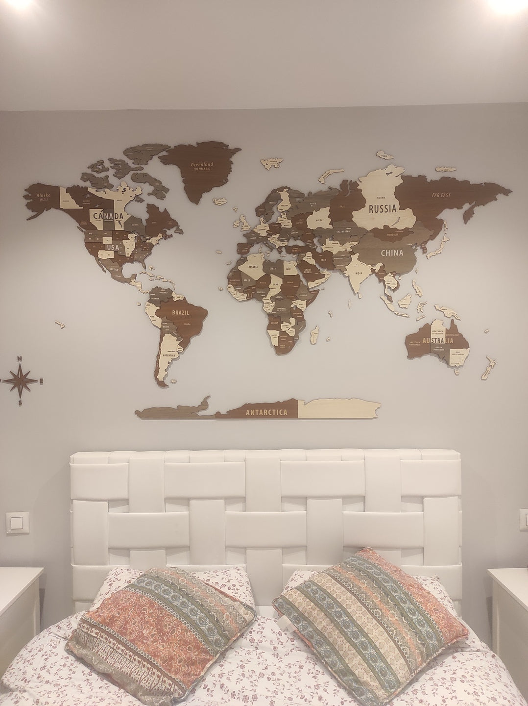 Wooden World Map Wall Art - 3d Wood Push Pin Maps, Multicolor in a customer's home