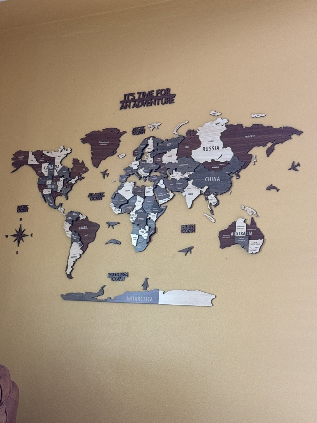 Wooden World Map Wall Art - 3d Wood Push Pin Maps, Multicolor in a customer's home