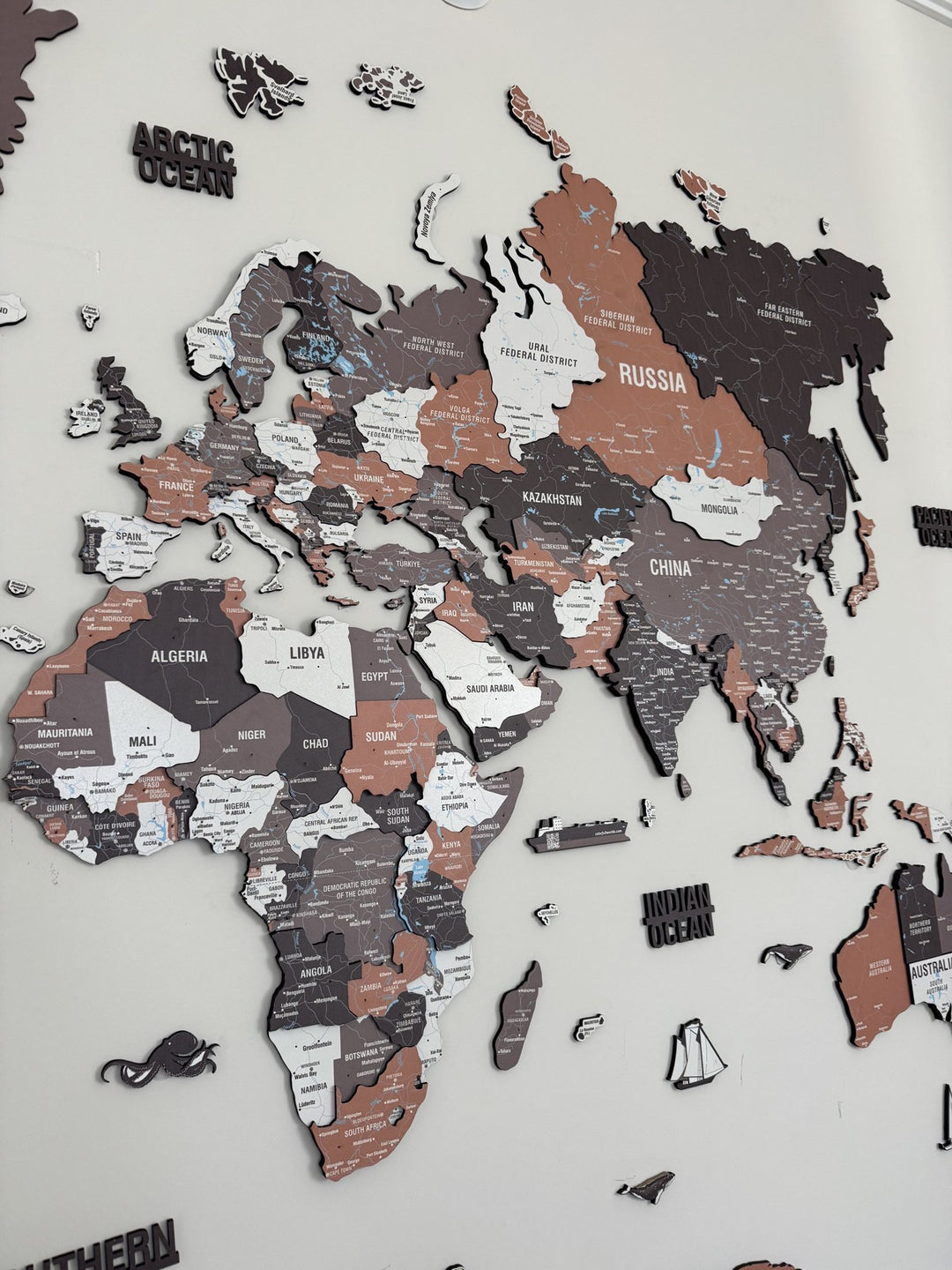 Wooden World Map Wall Art - UV Print, 3D Map with Vibrant Colors (Soil) in a customer's home
