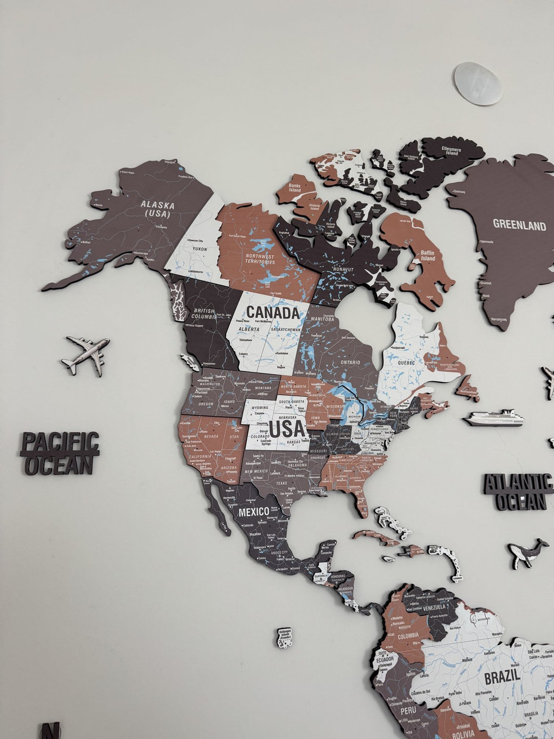 Wooden World Map Wall Art - UV Print, 3D Map with Vibrant Colors (Soil) in a customer's home