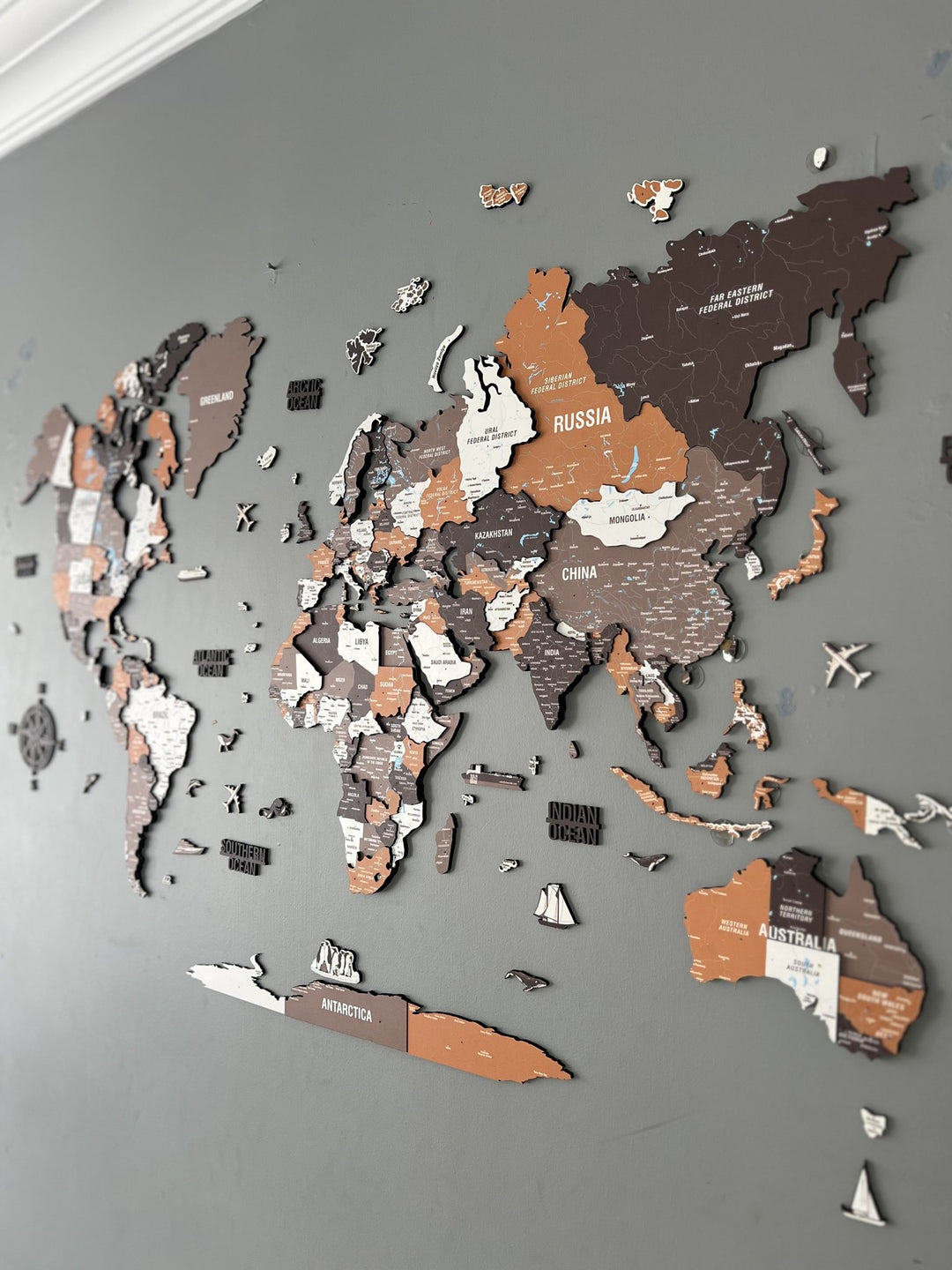 Wooden World Map Wall Art - UV Print, 3D Map with Vibrant Colors (Soil) in a customer's home