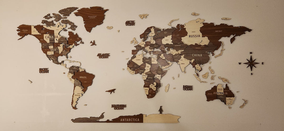 Wooden World Map Wall Art - 3d Wood Push Pin Maps, Multicolor in a customer's home