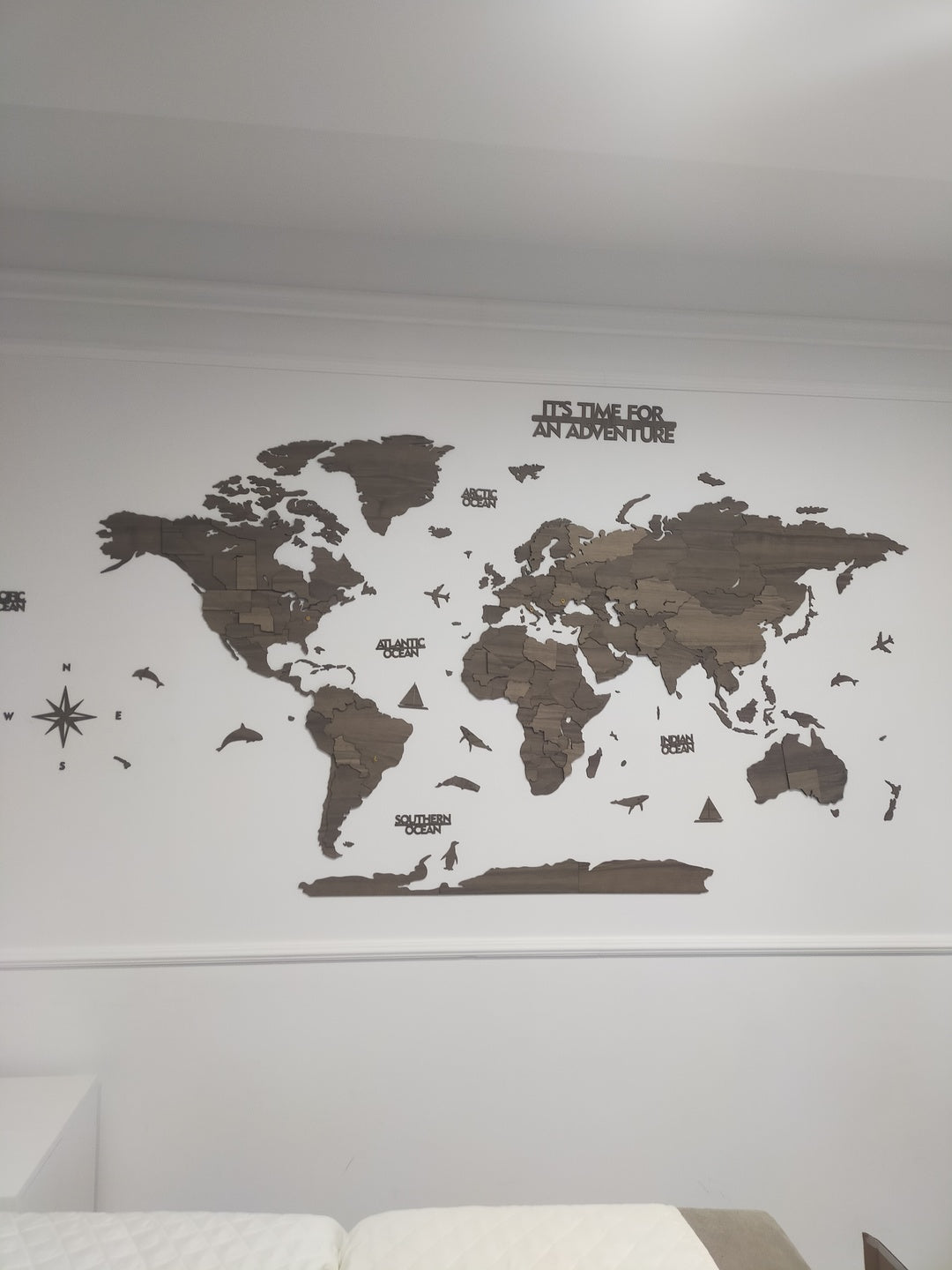 Wooden World Map Wall Art - 3d Wood Push Pin Maps, Multicolor in a customer's home