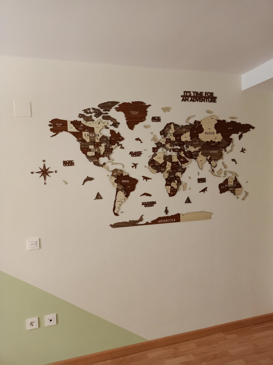 Wooden World Map Wall Art - 3d Wood Push Pin Maps, Multicolor in a customer's home