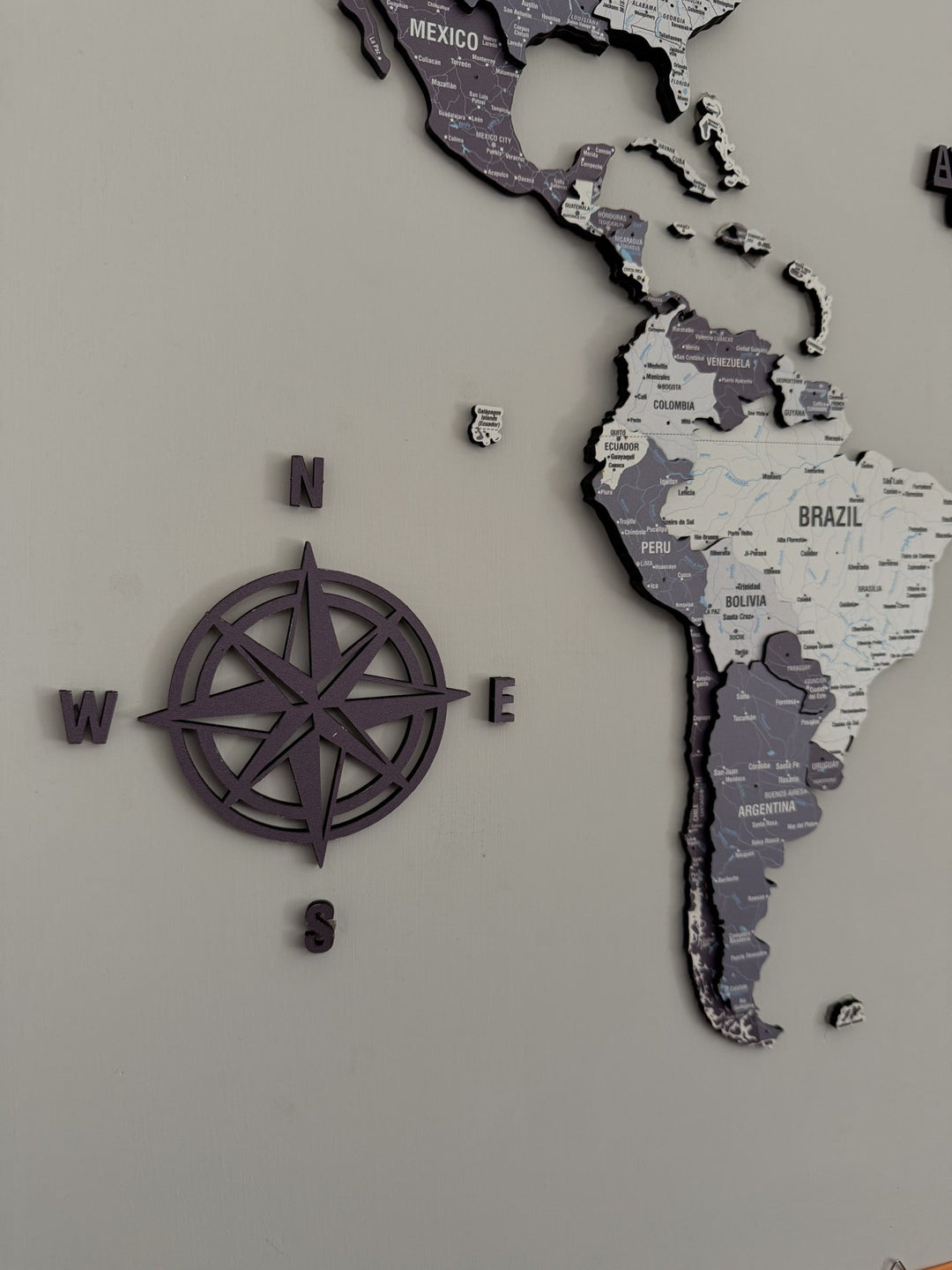 Wooden World Map for Wall - 3D Art & Vibrant Colors (Nimbus) in a customer's home