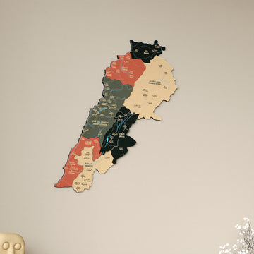 Sage Lebanon wooden wall map in sage green and terracotta, upright view with a cream figure at the corner
