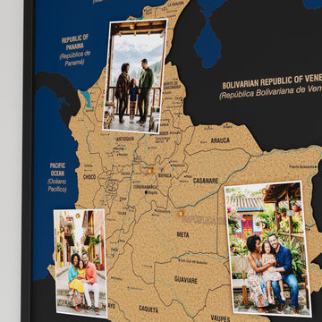 Close-up of Antioquia, Meta and Casanare on the black framed Colombia cork map with pinned photos