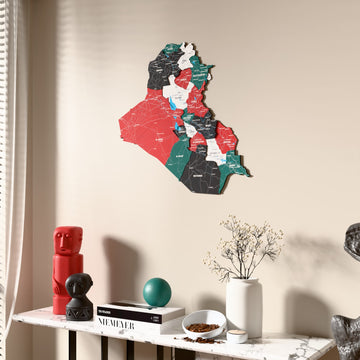 Flag colored Iraq wooden wall map beside a sheer curtain, angled view