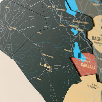 Close-up of the Sage Iraq wooden wall map with layered regions and printed names