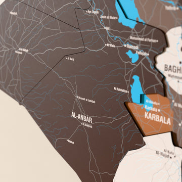 Close-up of the Soil Iraq wooden wall map with layered regions and printed names