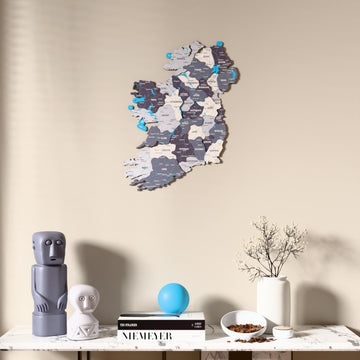 Nimbus Ireland wooden wall map above a marble console, front view