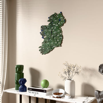 Satellite Ireland wooden wall map beside a sheer curtain, angled view