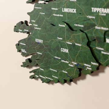 Close-up of the Satellite Ireland wooden wall map with layered regions and printed names