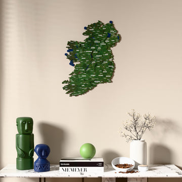 Satellite Ireland wooden wall map above a marble console, front view