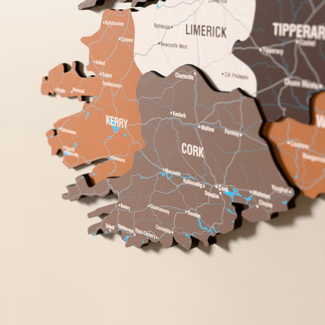 Close-up of the Soil Ireland wooden wall map with layered regions and printed names