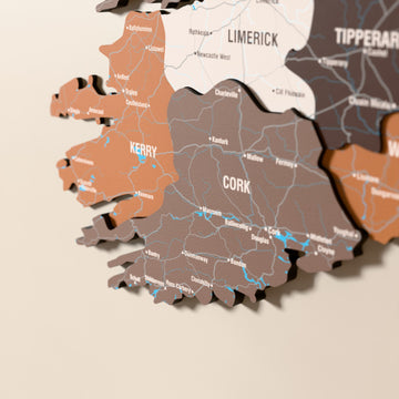 Close-up of the Soil Ireland wooden wall map with layered regions and printed names