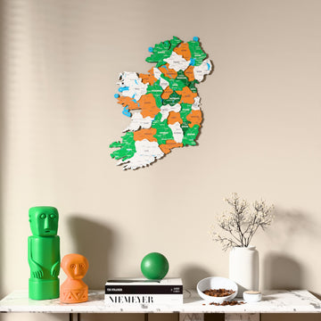 Flag colored Ireland wooden wall map above a marble console, front view