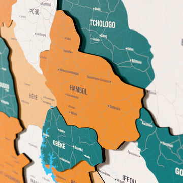 Close-up of the Flag colored Ivory Coast wooden wall map with layered regions and printed names