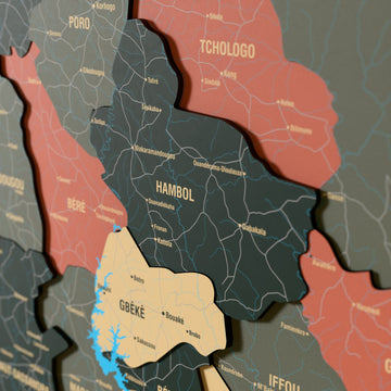Close-up of the Sage Ivory Coast wooden wall map with layered regions and printed names