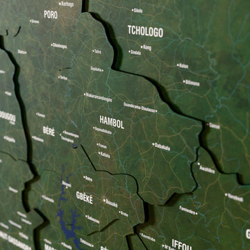 Close-up of the Satellite Ivory Coast wooden wall map with layered regions and printed names