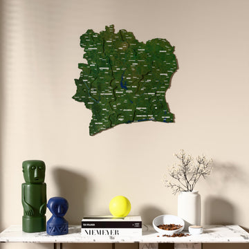 Satellite Ivory Coast wooden wall map above a marble console, front view