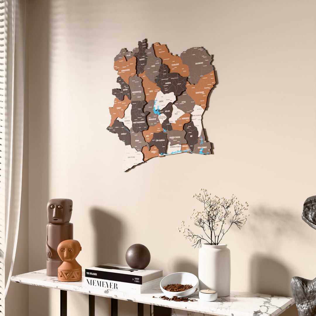 Soil Ivory Coast wooden wall map beside a sheer curtain, angled view