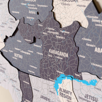 Close-up of the Nimbus Kazakhstan wooden wall map with layered regions and printed names