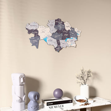 Nimbus Kazakhstan wooden wall map on a beige wall above a console with figurines