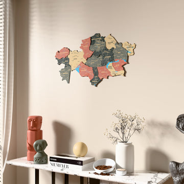Sage Kazakhstan wooden wall map beside a sheer curtain, angled view