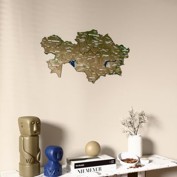 Satellite Kazakhstan wooden wall map on a beige wall above a console with figurines